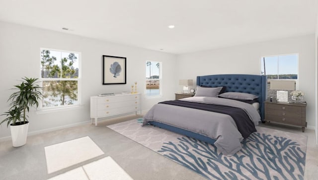 carpeted bedroom featuring recessed lighting and baseboards