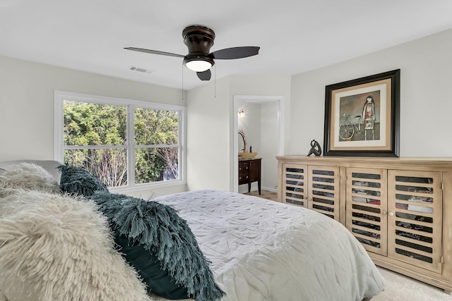 bedroom featuring ceiling fan and visible vents