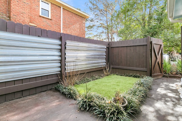 view of yard with a gate and fence