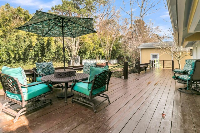 deck featuring outdoor dining space