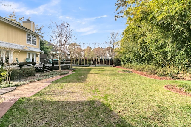 view of yard with a wooden deck