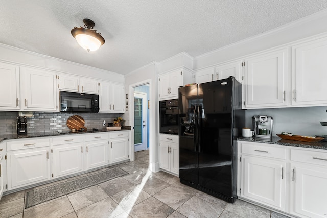 kitchen featuring white cabinets, decorative backsplash, and black appliances