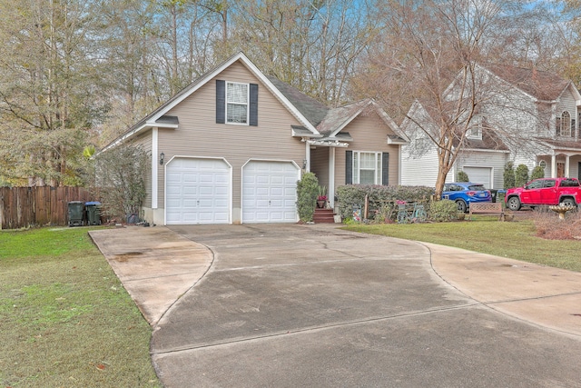 view of front facade featuring a front yard and a garage