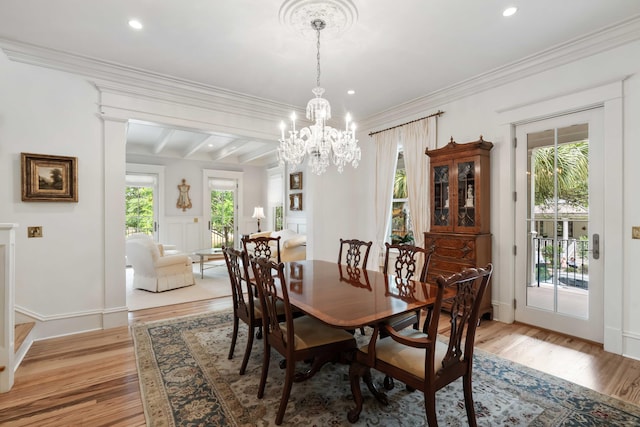 dining area with a chandelier, light wood-style flooring, recessed lighting, ornamental molding, and beamed ceiling