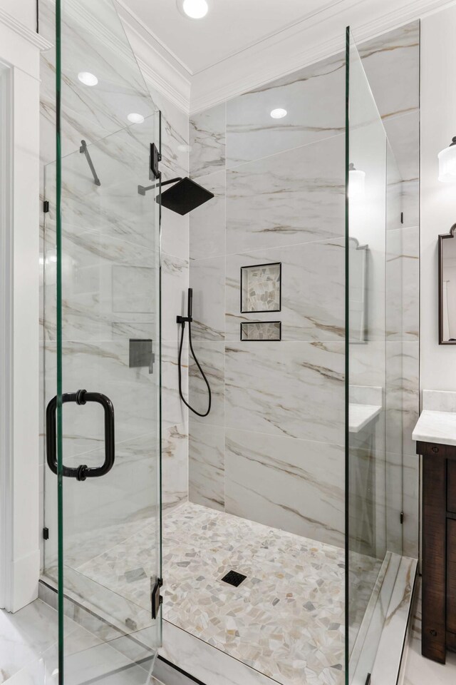 full bath featuring crown molding, a marble finish shower, vanity, and recessed lighting
