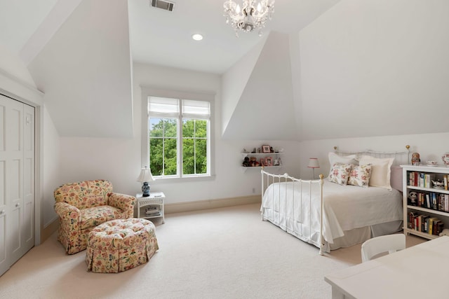 bedroom featuring vaulted ceiling, carpet floors, a chandelier, baseboards, and a closet