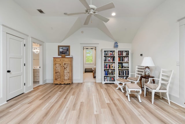 sitting room featuring ceiling fan, light wood-style flooring, vaulted ceiling, baseboards, and recessed lighting