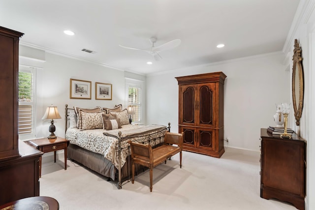 bedroom featuring light colored carpet, recessed lighting, crown molding, a ceiling fan, and baseboards
