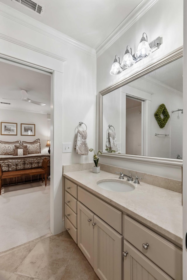 bathroom featuring connected bathroom, crown molding, and vanity