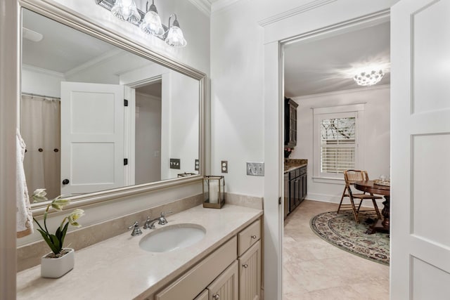 full bath with vanity, ornamental molding, and tile patterned floors