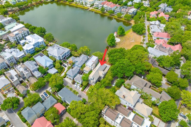 aerial view of residential area with a large body of water