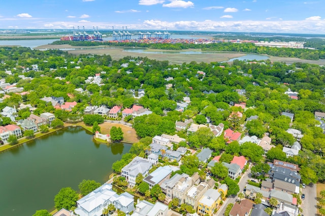 aerial perspective of suburban area with a nearby body of water