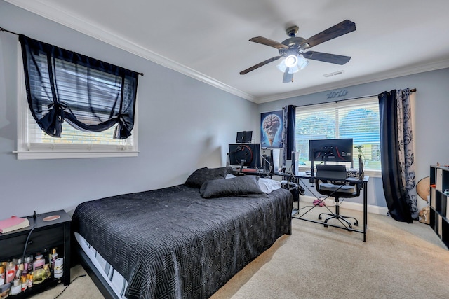 bedroom with ceiling fan, carpet floors, and ornamental molding