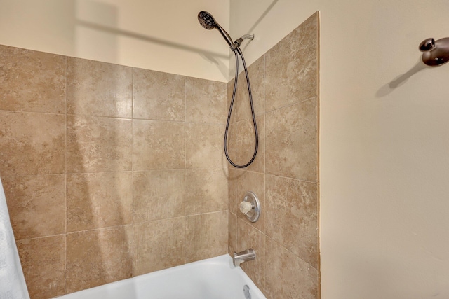 bathroom with shower / tub combo