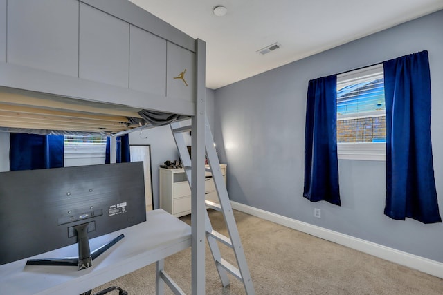 bedroom featuring light colored carpet