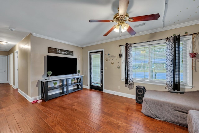 living area featuring hardwood / wood-style floors, ceiling fan, and ornamental molding