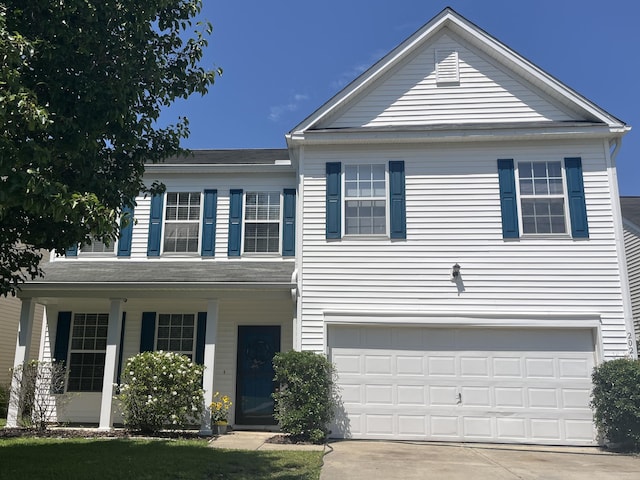 2021 Asher Loop, Summerville, SC 29485 - view of front of house with an attached garage, concrete driveway, and covered porch