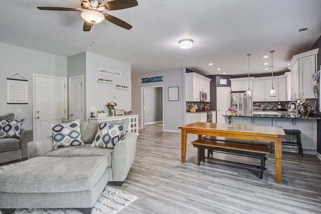 2021 Asher Loop, Summerville, SC 29485 - living room featuring a ceiling fan, light wood-type flooring, baseboards, and recessed lighting