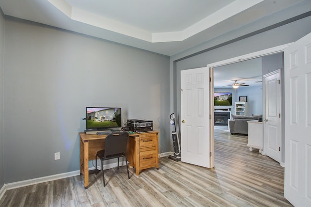2021 Asher Loop, Summerville, SC 29485 - office space with light wood-style flooring, a fireplace, ceiling fan, baseboards, and a raised ceiling