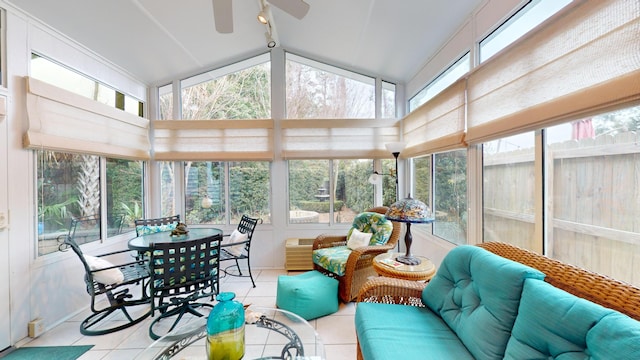 sunroom / solarium featuring lofted ceiling, a wealth of natural light, and a ceiling fan