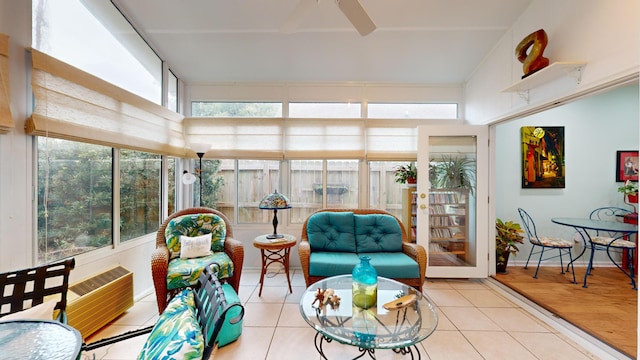 sunroom / solarium featuring ceiling fan