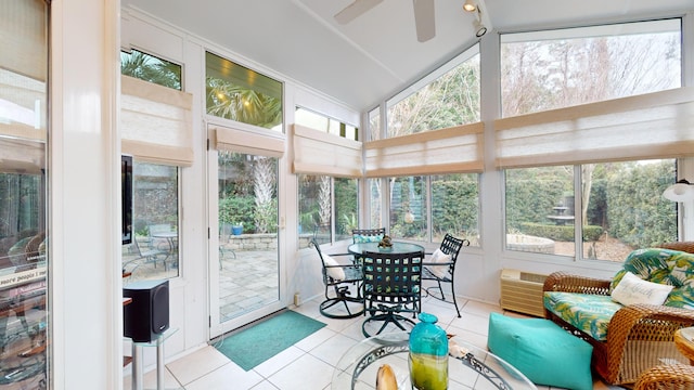 sunroom / solarium featuring a ceiling fan and plenty of natural light