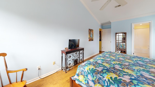 bedroom featuring visible vents, ornamental molding, ceiling fan, wood finished floors, and baseboards