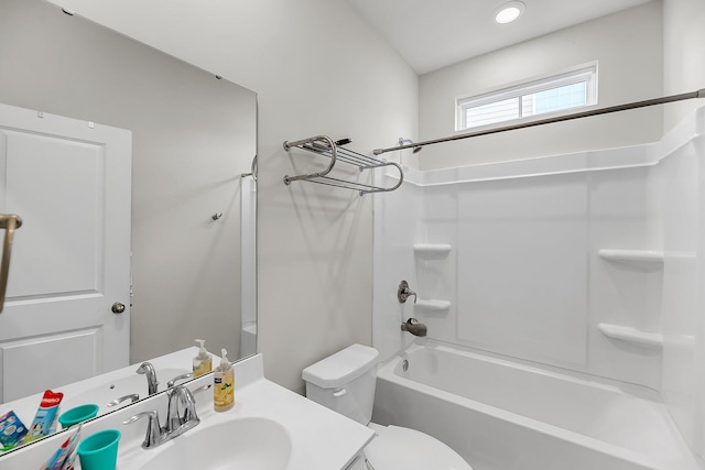full bathroom with toilet, vanity, and shower / tub combination