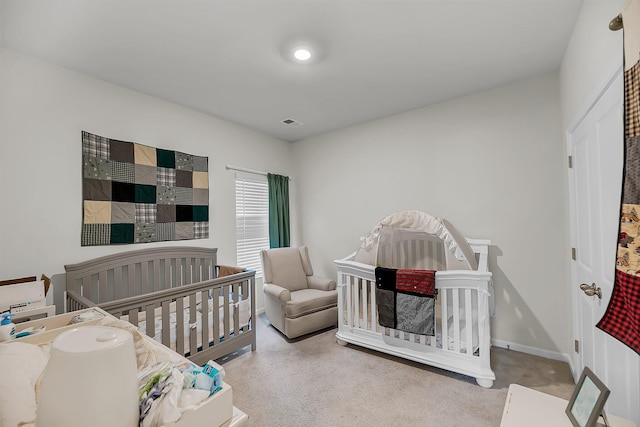bedroom with visible vents, carpet flooring, and baseboards