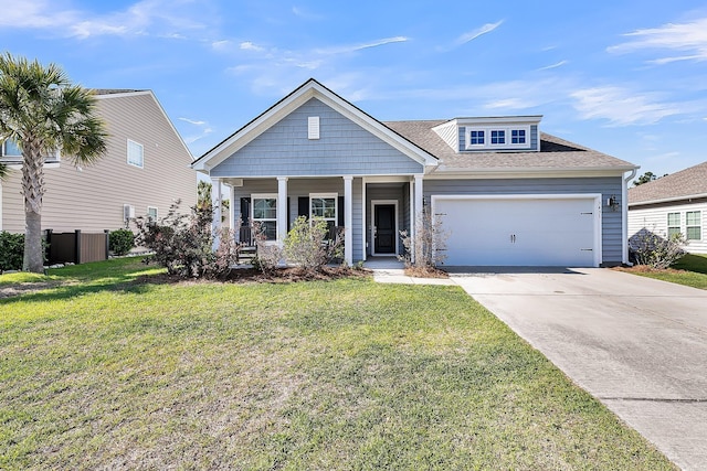 craftsman-style home featuring a garage, a porch, a front lawn, and concrete driveway