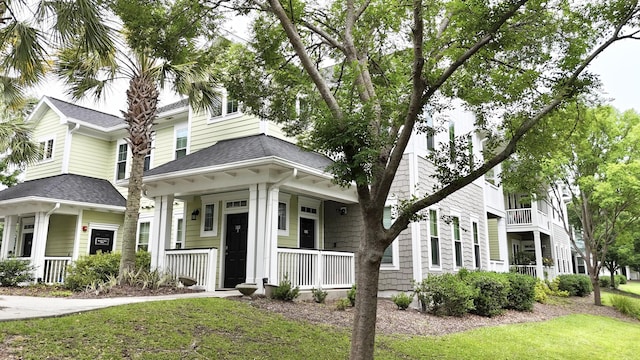 1225 Blakeway St Unit 906, Charleston, SC 29492 - view of front of property featuring covered porch, roof with shingles, and a front lawn