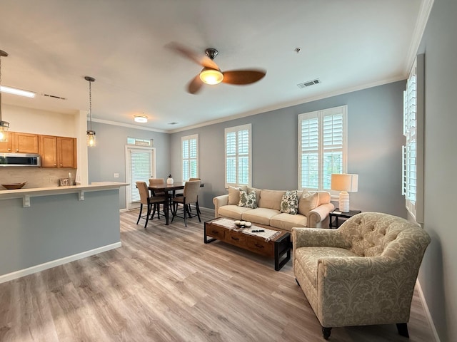 1225 Blakeway St Unit 906, Charleston, SC 29492 - living room with crown molding, a ceiling fan, light wood-style floors, and baseboards