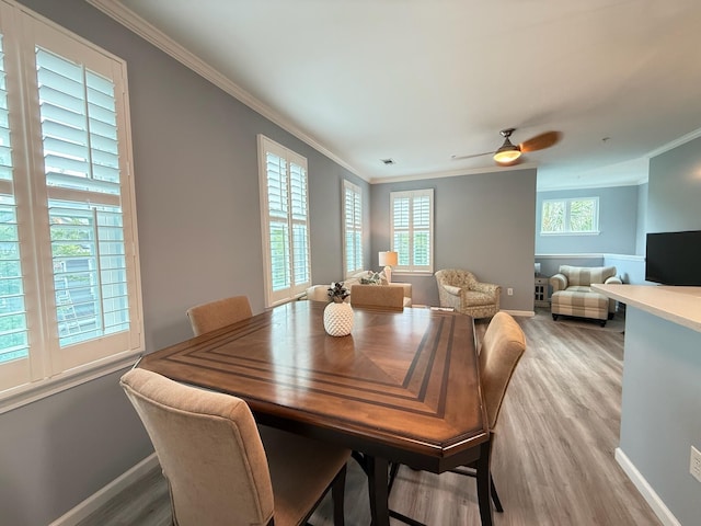 1225 Blakeway St Unit 906, Charleston, SC 29492 - dining area with crown molding, light wood-style floors, ceiling fan, and baseboards