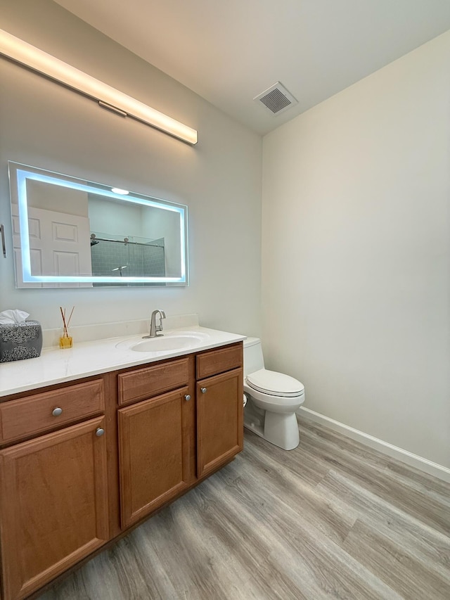 1225 Blakeway St Unit 906, Charleston, SC 29492 - bathroom with wood finished floors, vanity, toilet, baseboards, and a shower