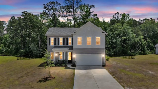 1132 Wading Point Blvd, Huger, SC 29450 - view of front facade featuring driveway, board and batten siding, and an attached garage