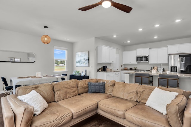 1132 Wading Point Blvd, Huger, SC 29450 - living room with recessed lighting, ceiling fan, dark wood-style flooring, and baseboards