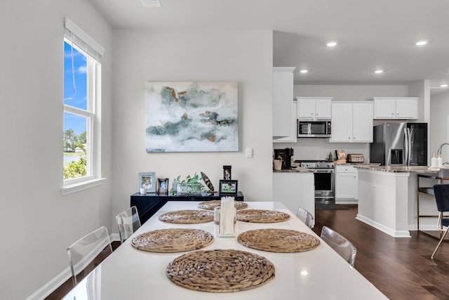 1132 Wading Point Blvd, Huger, SC 29450 - dining room featuring dark wood-style floors, recessed lighting, and baseboards