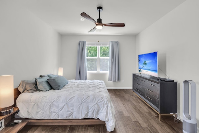 1132 Wading Point Blvd, Huger, SC 29450 - bedroom featuring dark wood-style flooring, ceiling fan, and baseboards