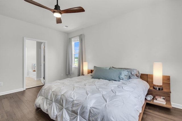 1132 Wading Point Blvd, Huger, SC 29450 - bedroom with wood finished floors, baseboards, ceiling fan, and ensuite bathroom