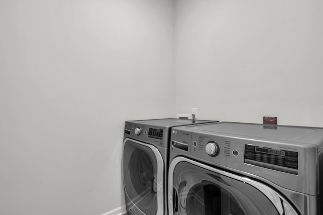 1132 Wading Point Blvd, Huger, SC 29450 - washroom with washing machine and dryer and baseboards