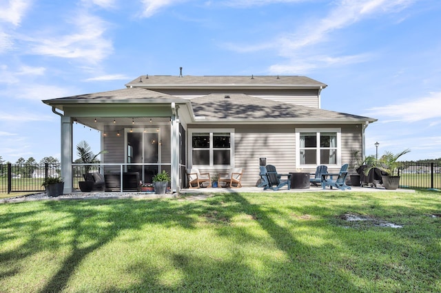 1132 Wading Point Blvd, Huger, SC 29450 - rear view of house with a patio, a fire pit, a sunroom, and a shingled roof