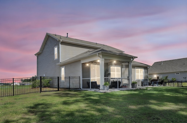 1132 Wading Point Blvd, Huger, SC 29450 - back of property at dusk featuring a sunroom