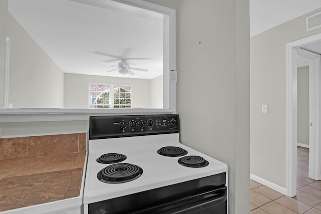 kitchen with light tile patterned floors, visible vents, baseboards, electric stove, and ceiling fan