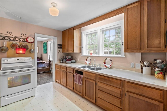 kitchen with white electric range and sink