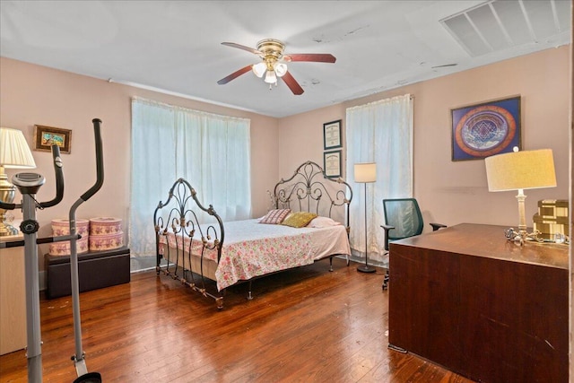 bedroom with wood-type flooring and ceiling fan