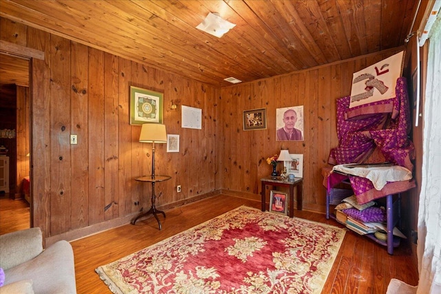 interior space featuring hardwood / wood-style flooring and wood walls