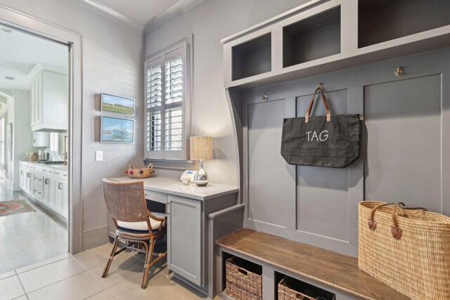 interior space with sink and light tile patterned floors