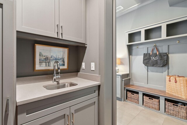 washroom with separate washer and dryer, electric panel, and cabinets