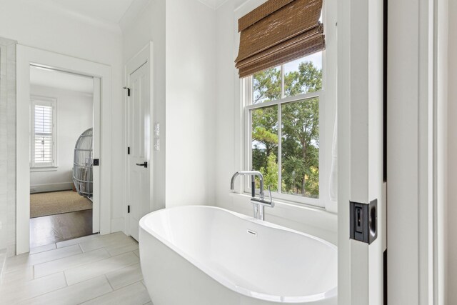 bathroom with tile patterned flooring, separate shower and tub, vanity, and ornamental molding