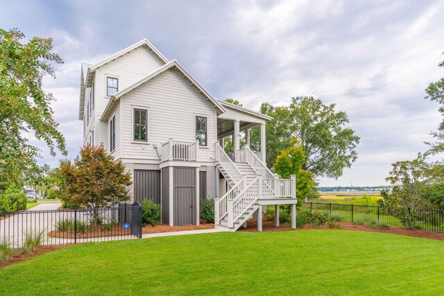 rear view of house with a patio and a yard